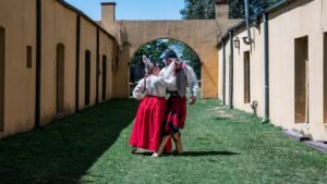 Eventos A couple in traditional gaucho attire dancing in Chascomús, Argentina.